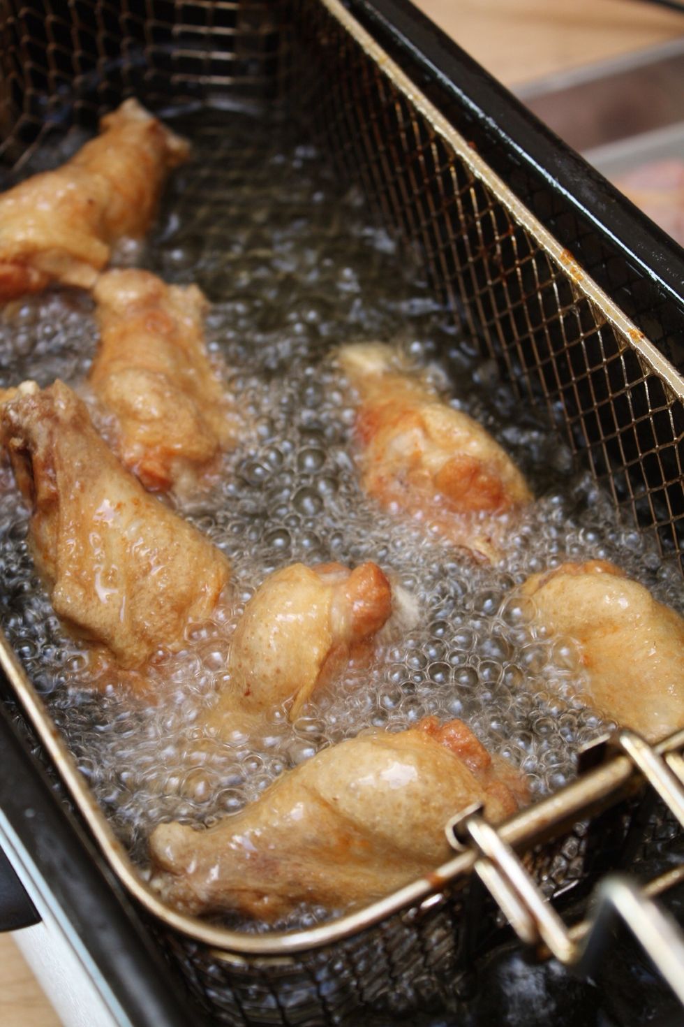 Fry until the chicken is golden brown, and the center part next to the bone tests done.