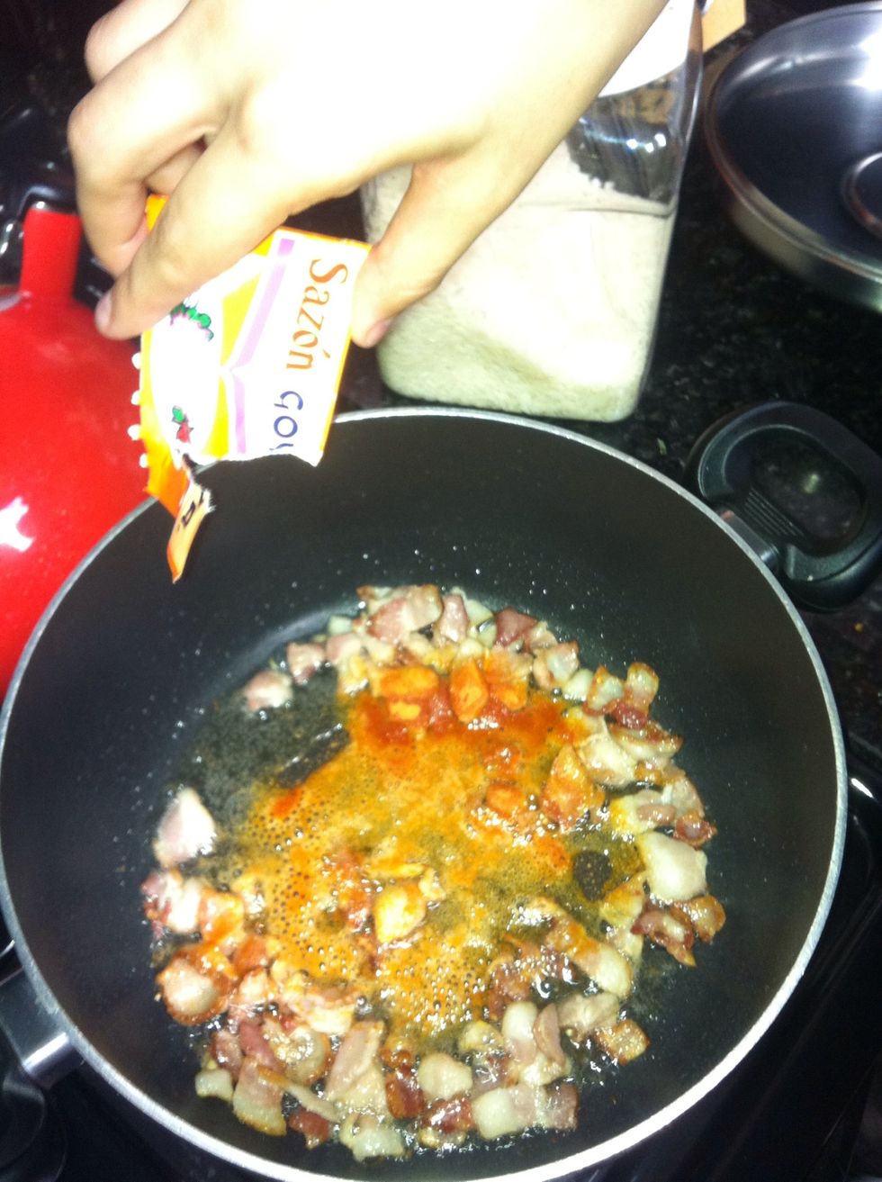 Fry up the bacon make sure it's crispy then add one packet of sazon