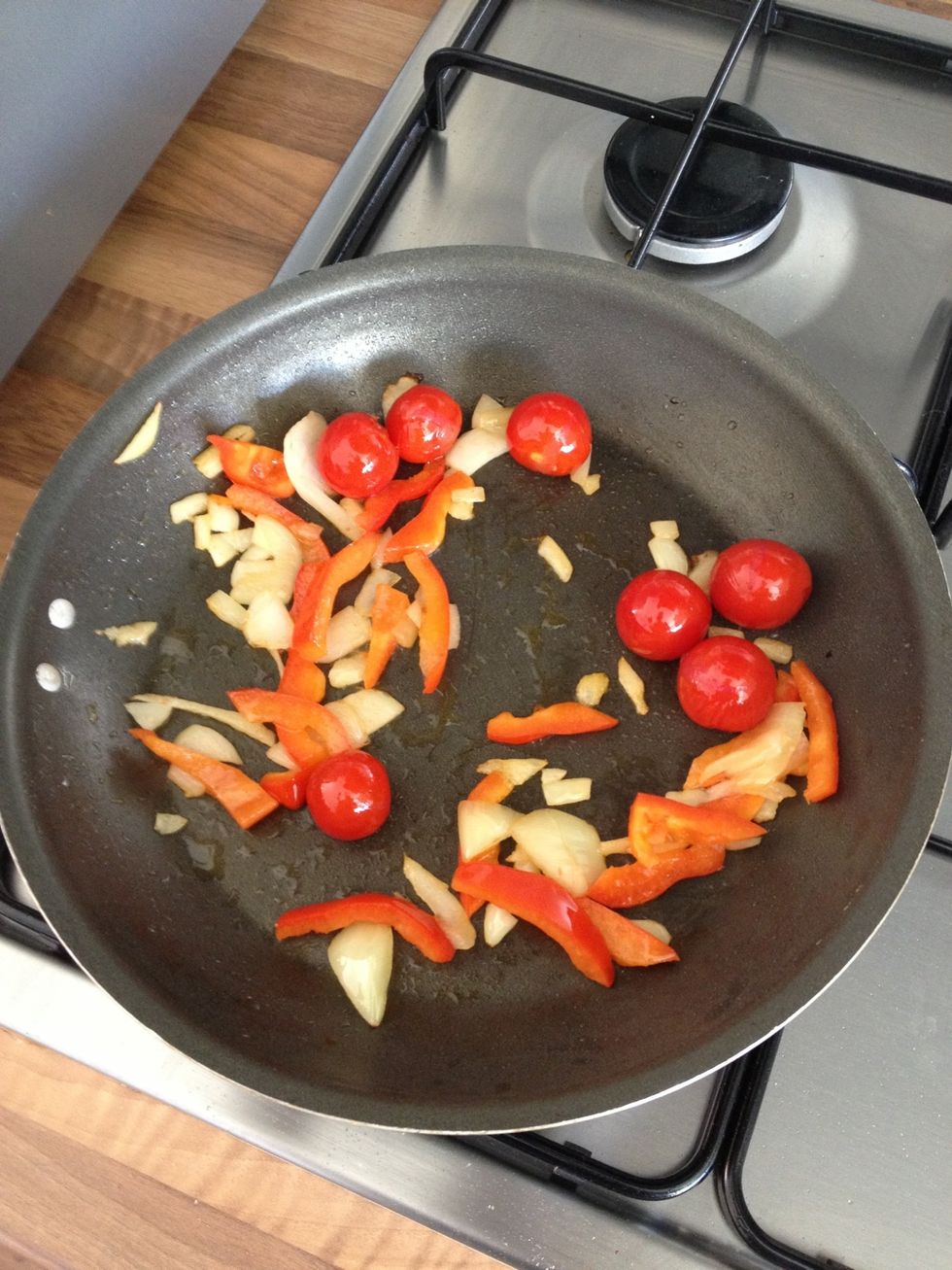 Fry your vegetables until the onion has browned and the pepper/tomatoes have softened.