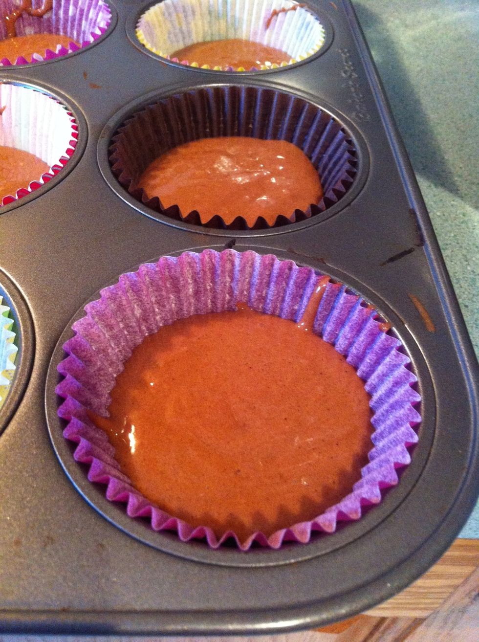 Full cupcake holders about 1/2-3/4 full of mix.