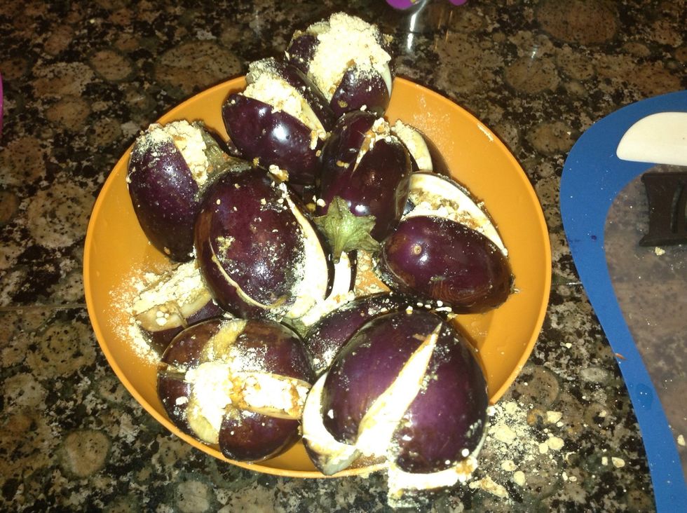 Full the eggplants with the dry mixture like this