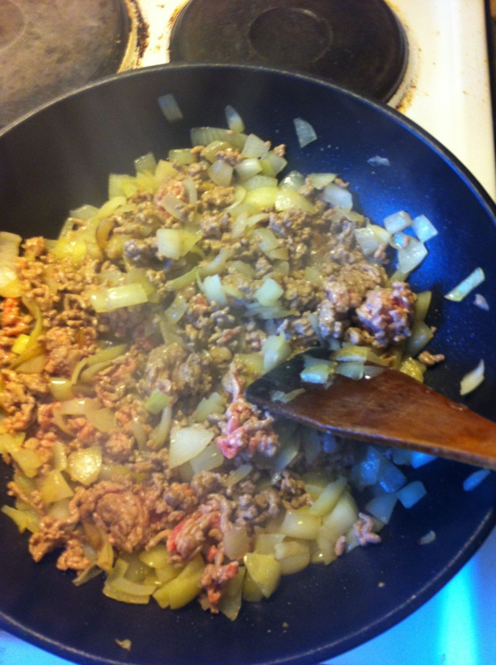 Further fry it until the meat almost fully cooked