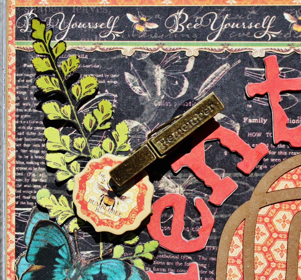 Fussy cut butter flies and leaves from pattern paper; adhere to front of frame along with metal clothespin and chipboard.