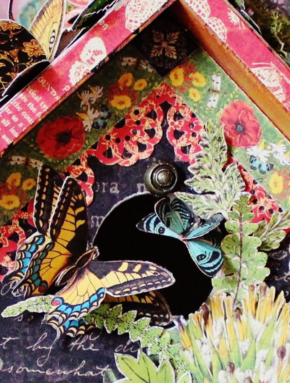 Fussy cut butterflies from pattern paper; layer together and adhere to birdhouse.