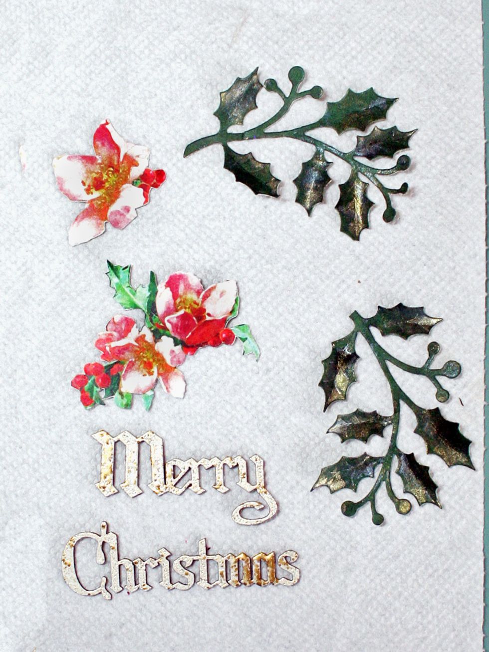 Fussy cut flowers from Graceful Garland paper & diecut holly leaves. Dab Lindy's mist on the leaves for interest. The sentiment is done with Creative Embellishments chippys. Use whatever you like.