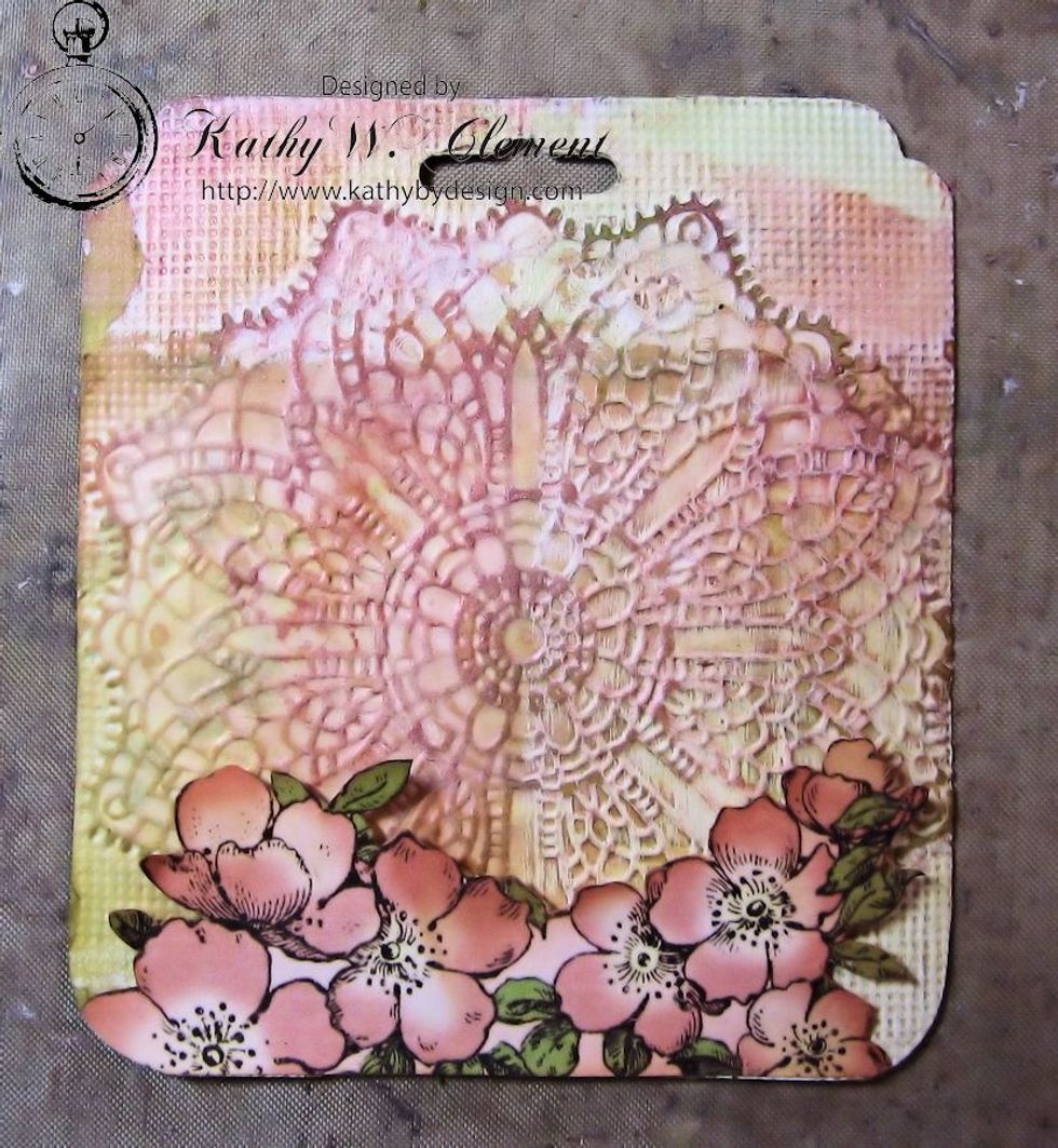 Fussy cut flowers from Once Upon a Springtime Primrose Cottage. I fussy cut 3 sets, one for each tag. Glue just the bottom edge to the base of the tag. Use foam dimensionals halfway up to create lift.