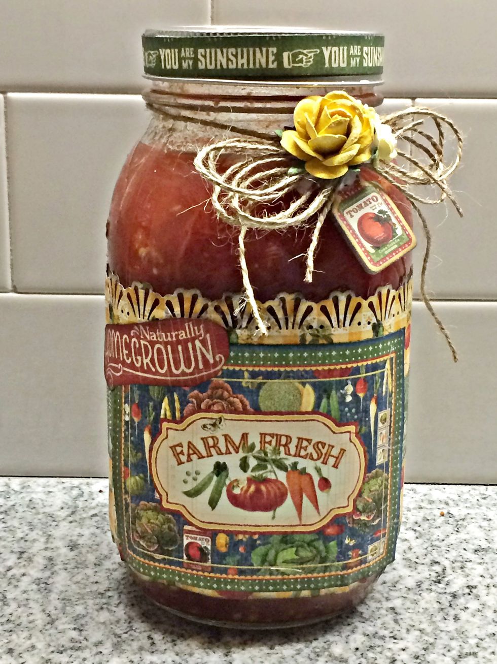 Fussy cut Graphic 45 cardstock "Naturally Homegrown", add twine, flowers and coordinating chipboard. Cut a strip of border from the Country Life cardstock (appoximately 1/2 x 12) and glue to the lid.