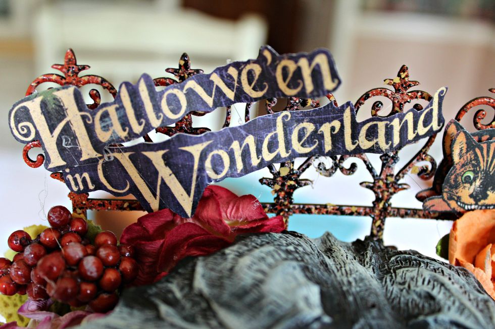 Fussy cut "Halloween in Wonderland"; adhere to top of hall tree.