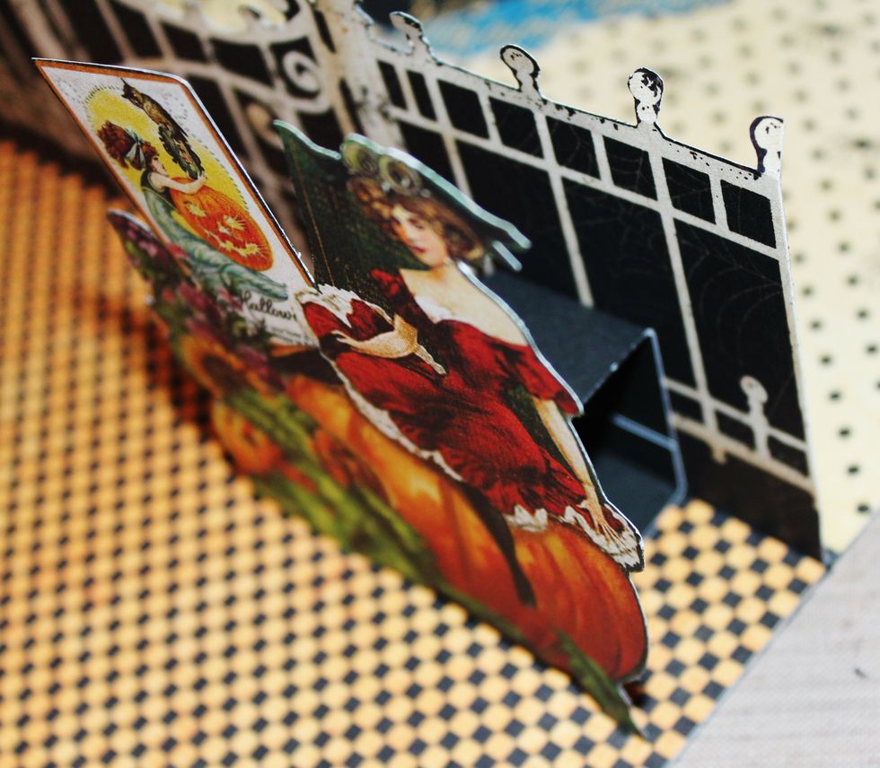 Fussy cut images from pattern paper. Adhere to front of pop up square.