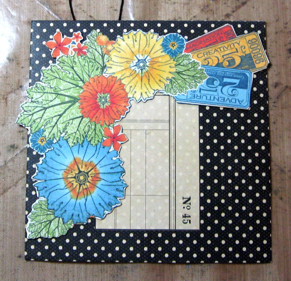 Fussy cut large floral border from 12x12 World's Fair paper. Glue in place, as seen here, leaving a little margin around the edges that is not glued down. This will enable us to layer images later.