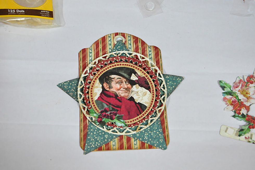Fussy cut one of the journal spots and use as center of the tag