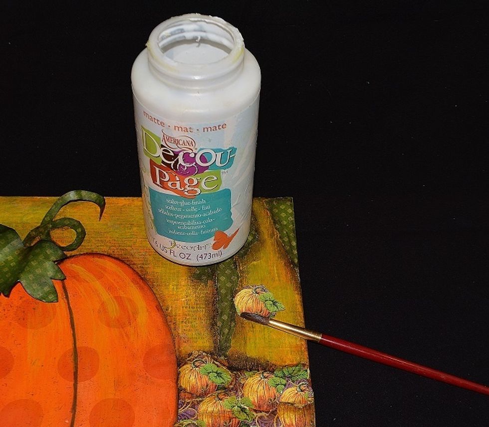 Fussy cut (or tear) pumpkins from the Abracadabra paper and adhere with decoupage glue.