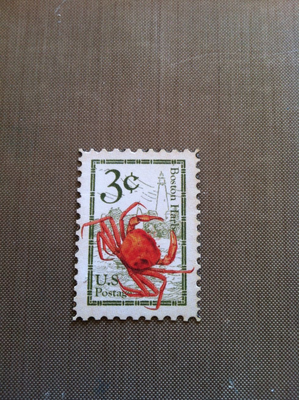 Fussy cut out one of the stamps from your leftover 12x12" paper. I used a 1/16th hole punch to give it that stamp edge.