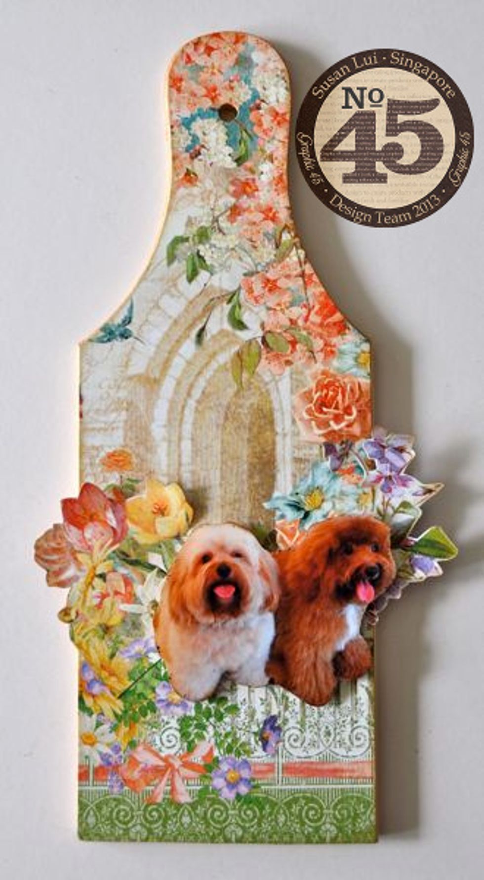 Fussy cut some flowers from the patterned paper & attach to the chipboard. Silhouette cut a photograph and attach as well.