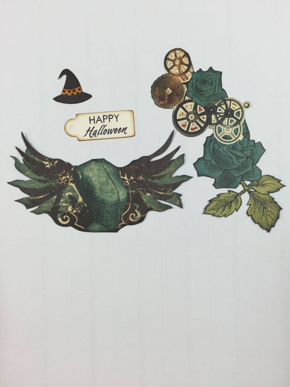 Fussy cut steampunk images from paper collection as shown. Stamp witch's hat and Happy Halloween sentiment (Close To My Heart) onto ivory cardstock. Cut out and ink edges.