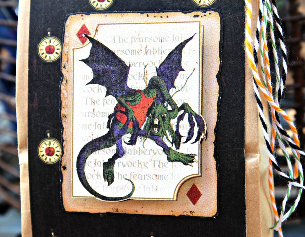 Fussy cut two card images from pattern paper. Adhere to front one to front of treat bag and the second place on  with pop dots.