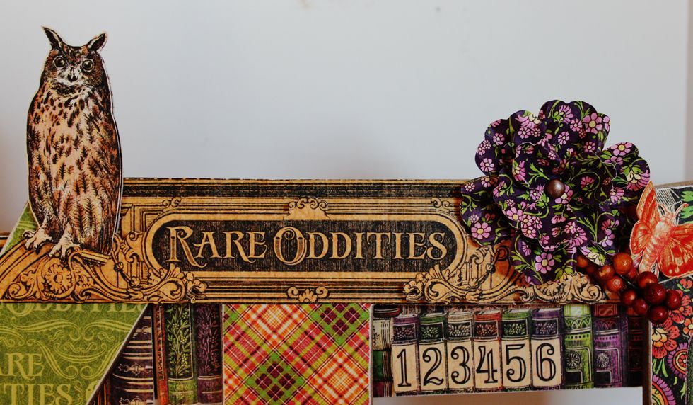 Fussy cut two "Rare Oddities" Signage from Rare Oddities paper; place together with pop dots. Add to top of "Wicked Sign".