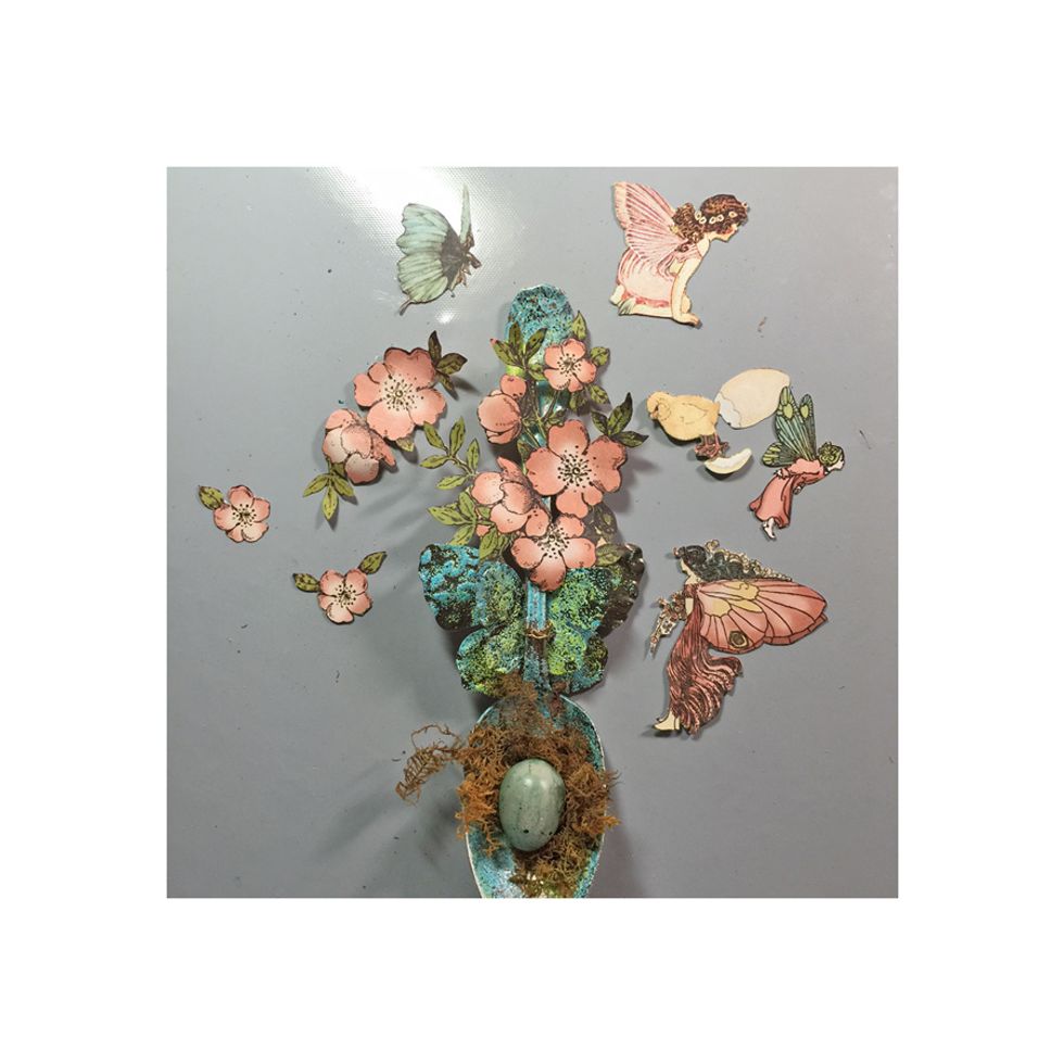 Fussy cut various images from the Deluxe Once Upon a Springtime collection from Graphic 45. These images are perfect for this spring themed spoon. Glue down along the spoon.