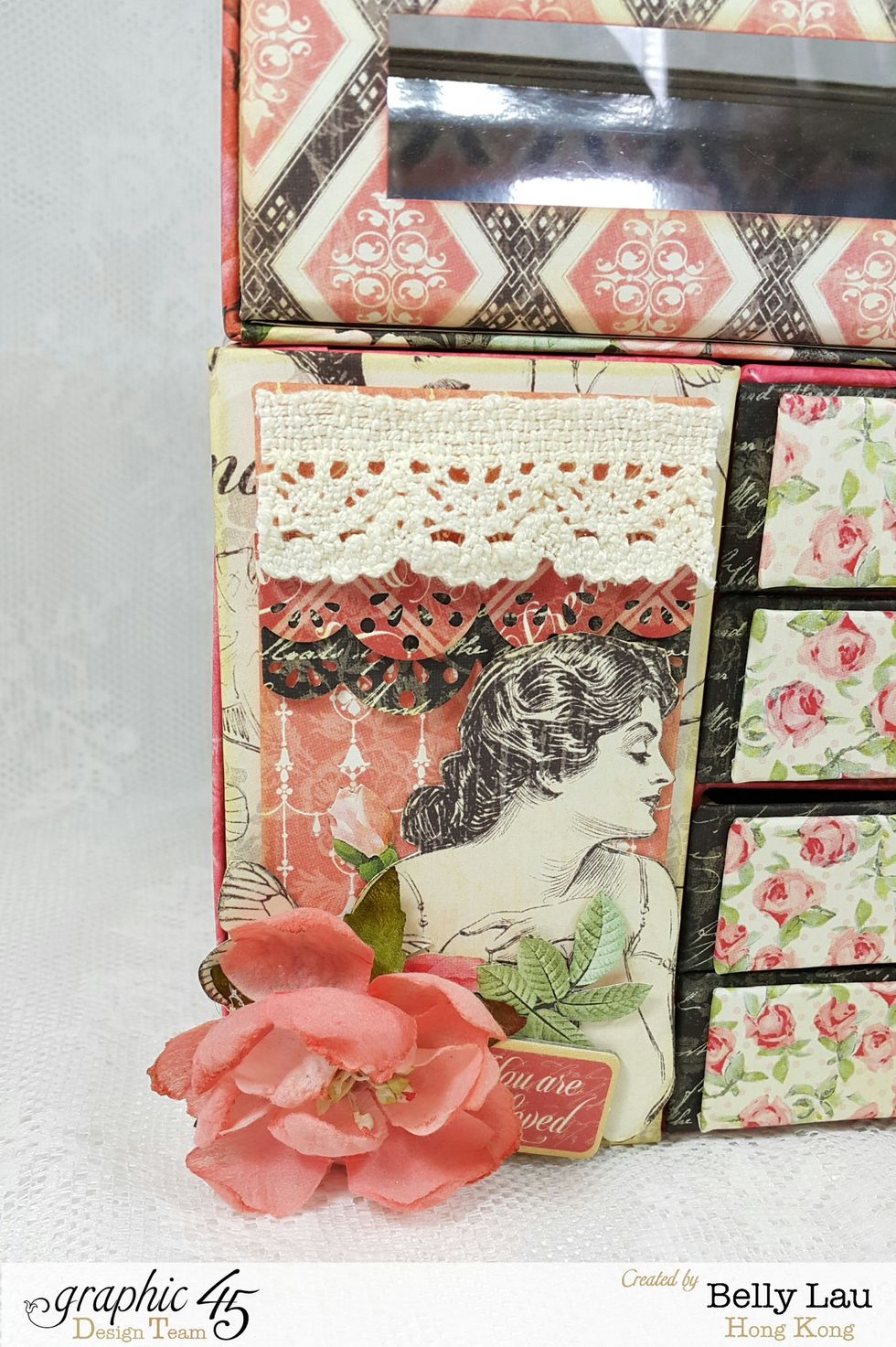 Fussy cuttings, lace, flowers, punch outs and chipboard for the doors.