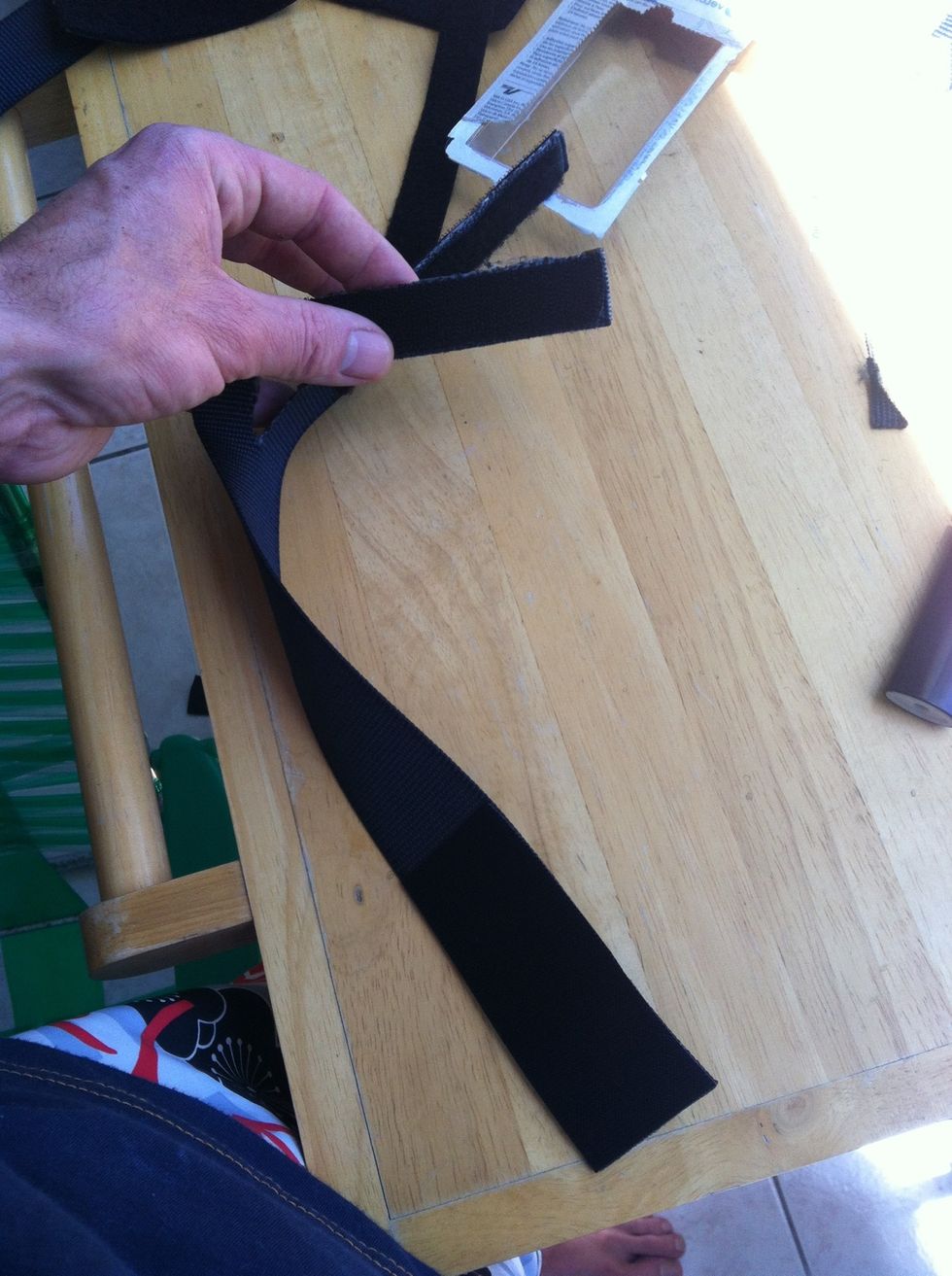 Fuzzy on one tabbed end. Hooked on both ends on the other side.