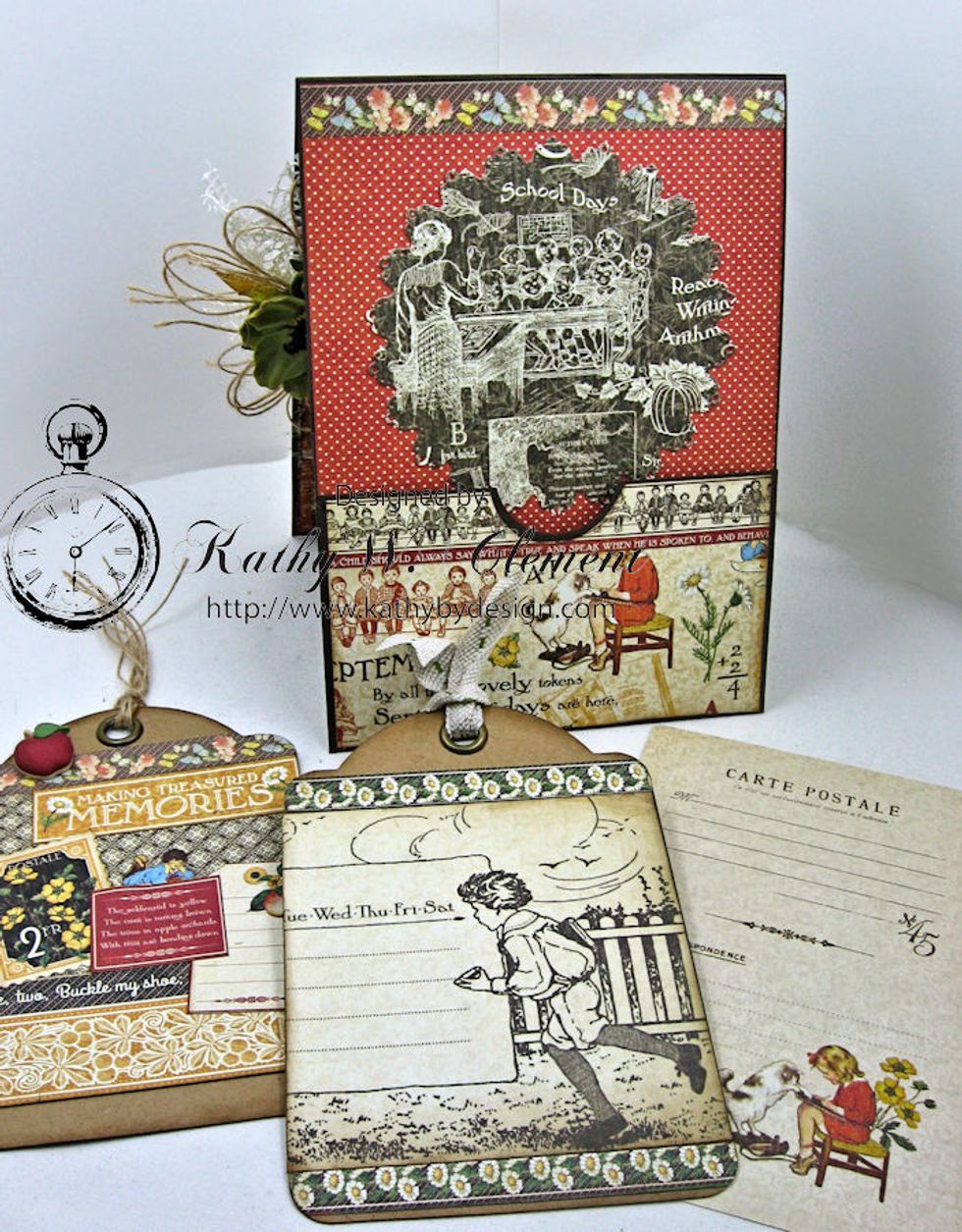 G45 Staples Regular Kraft Tags are decorated with images from the cut apart pages. I die cut a circle with Spellbinder's Exquisite Circles and glued above the pocket. The border is a sticker.