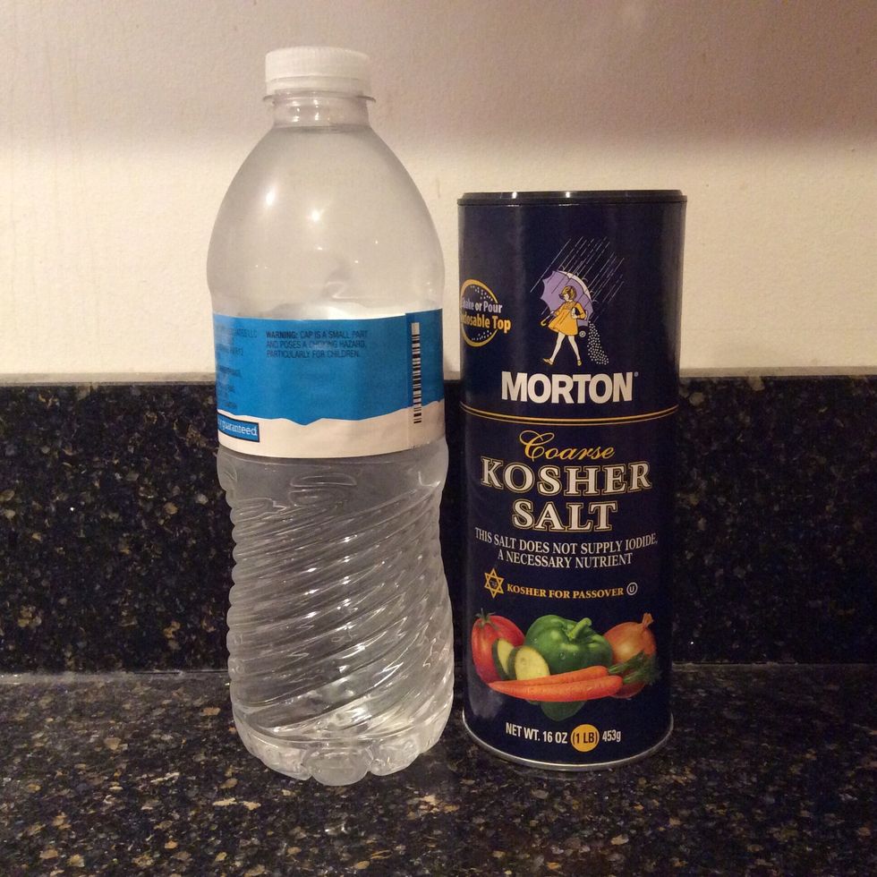 Gargle salt water for 10-30 seconds. DO NOT SWALLOW IT. You'll get really thirsty because you're drinking salt (duh).