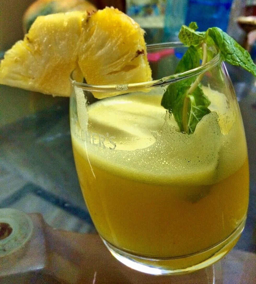Garnish with a slice of pineapple and a stem of mint..