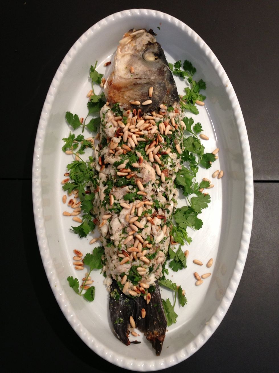 Garnish with more pine seeds, fresh leaves of parsley and coriander. You can add few olives