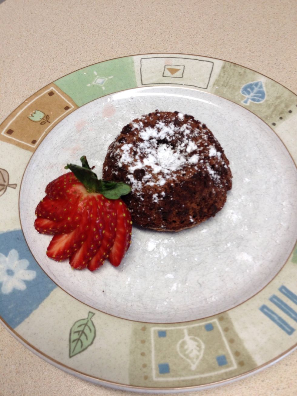 Garnish with powdered sugar and a strawberry