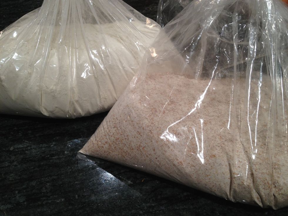 Gather 2 pounds of organic unbleached white flour and 2 pounds of organic whole wheat bread flour.
