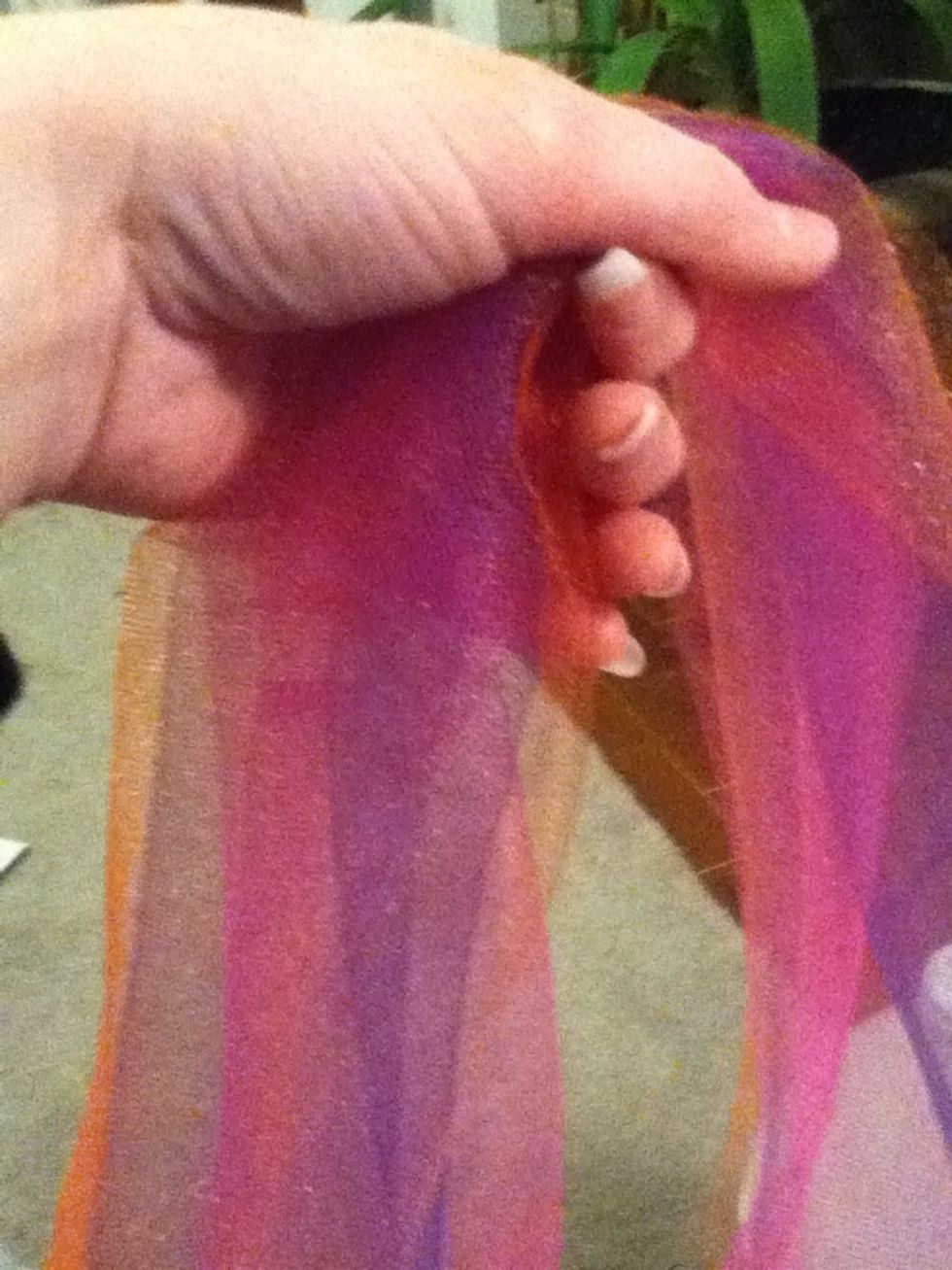 Gather 3 pieces of tulle, and open so it is only 1 layer, not folded.