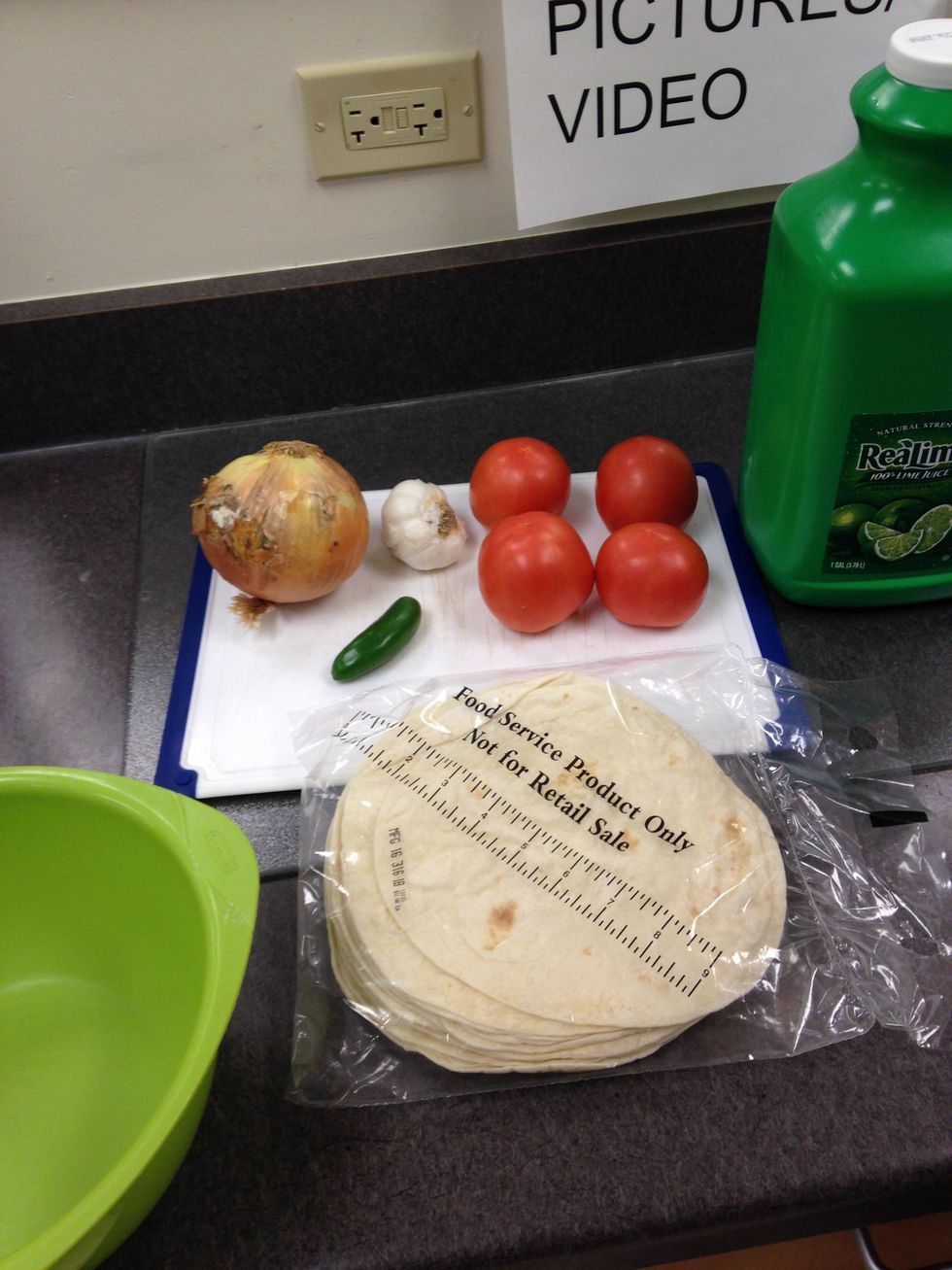 Gather 4 tomato, 3 cloves of garlic, 1 jalapeno, 1 large onion, A package of tortillas, and 2 tablespoons of lime juice.