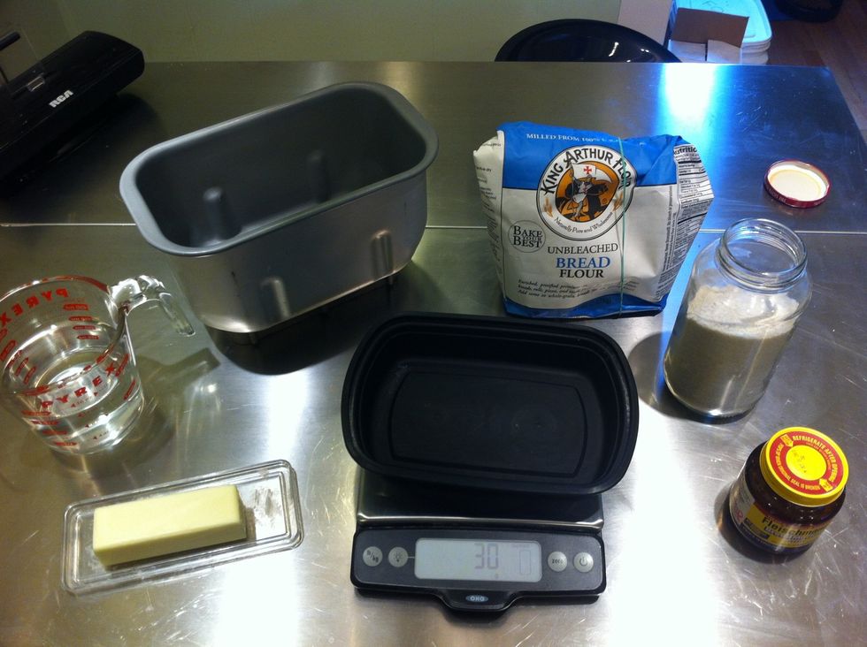 Gather 460g flour, 355ml water, 2tsp yeast, 1.5tsp salt, 1tbs butter.