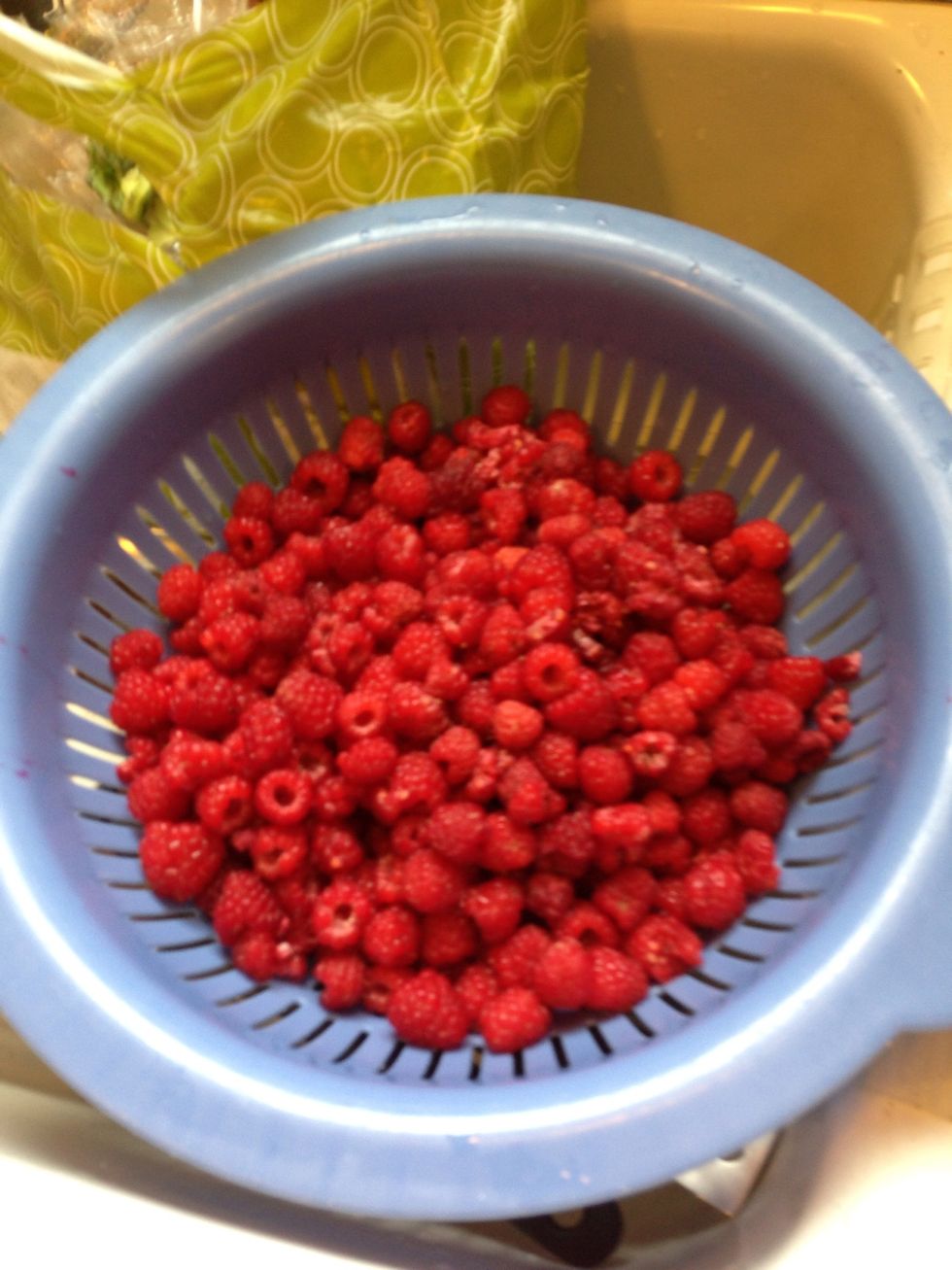 Gather a bowl full of fresh raspberries.