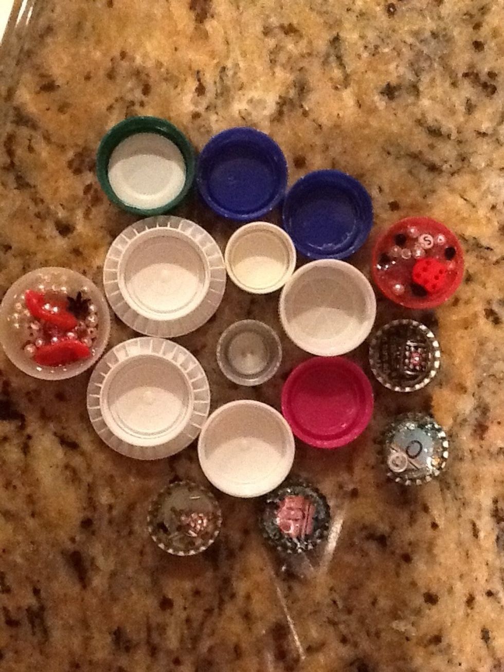 Gather a few dozen caps.  All shapes and sizes!  Bottle caps, milk jug caps, plastic caps..  I usually keep a jar in my kitchen cupboard to collect caps as bottles get emptied.