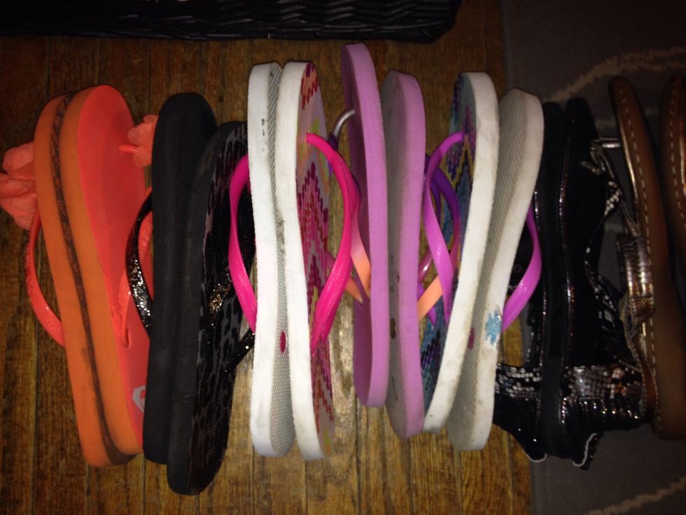 Gather all flip flops and sandals. Place them bottom to bottom.(for space saving and sanitary purposes If you think like me! Lol)\ud83d\ude4a