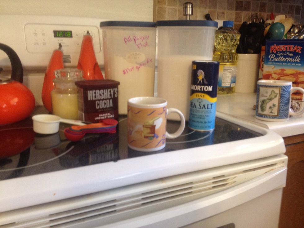 Gather all purpose flour, sugar, cocoa powder, olive oil, and water