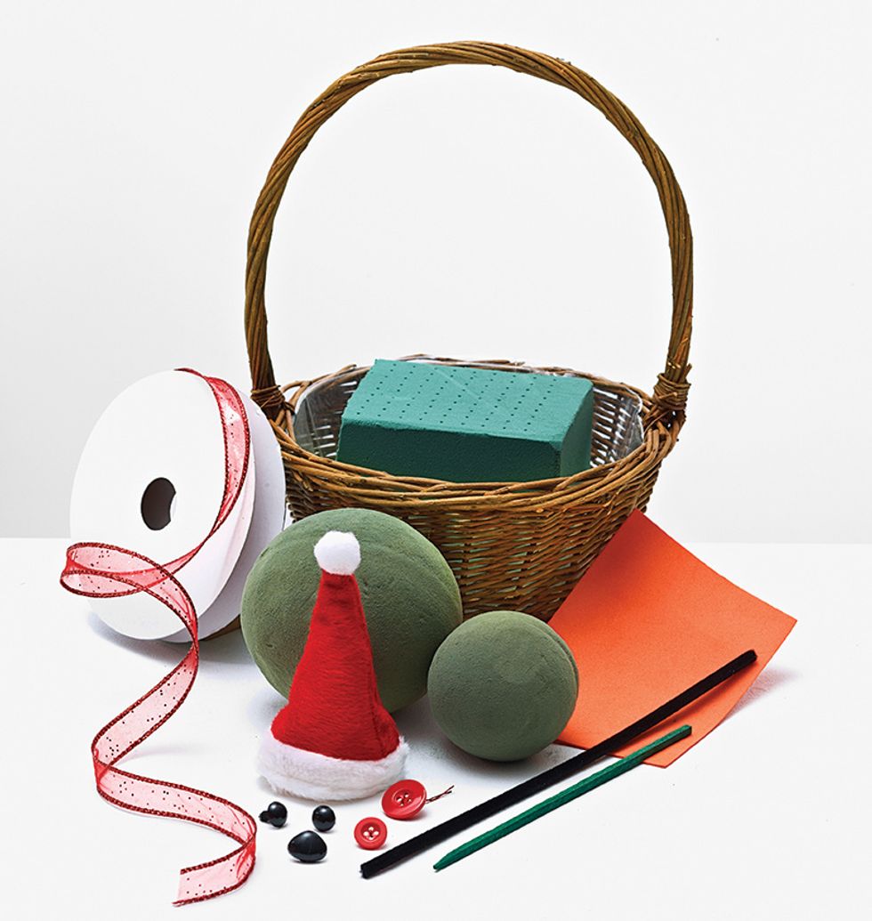 Gather all supplies, basket, oasis and accessories. Attach 1/3 block of oasis to the basket liner.