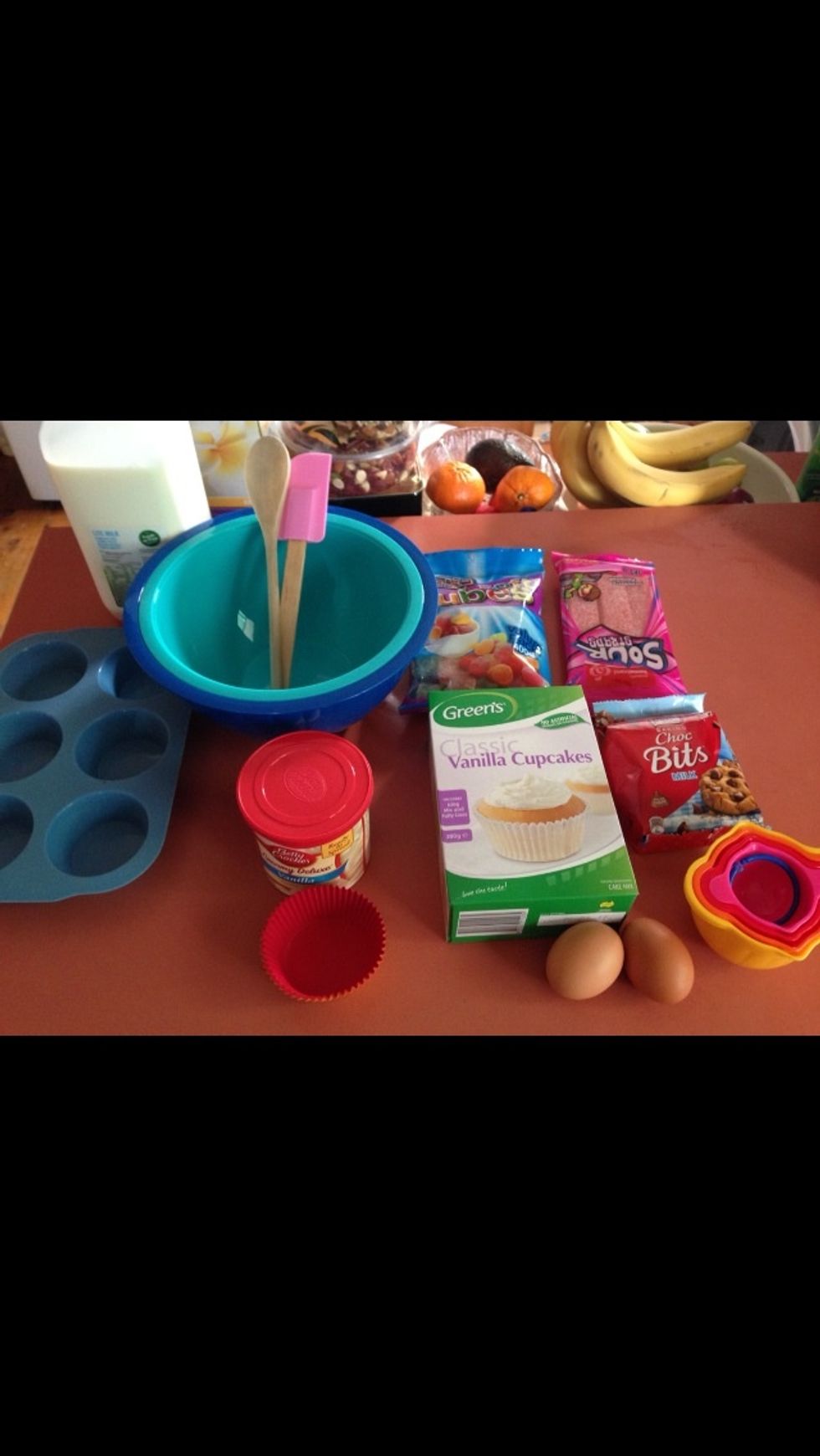 Gather all the Ingredients and utensils needed to create these cupcakes.