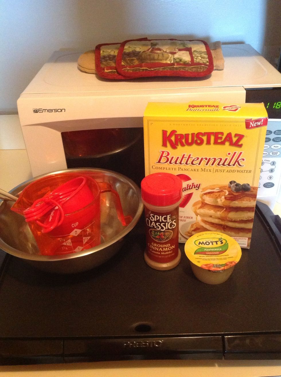 Gather all the necessary ingredients and tools needed to make your awesome pancakes (water not shown).