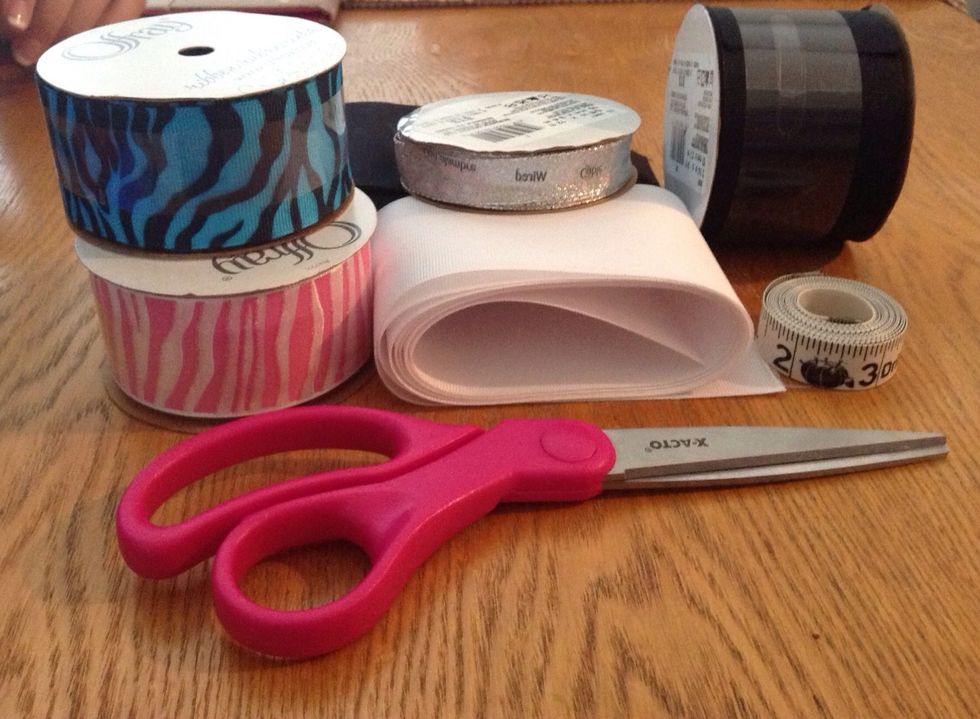 Gather all the supplies needed. This includes the ribbon, one 3in or larger and one 1 1/2 in. A nice sharp pair of scissors is rcommended as well. To measure use a yard stick or measuring tape.