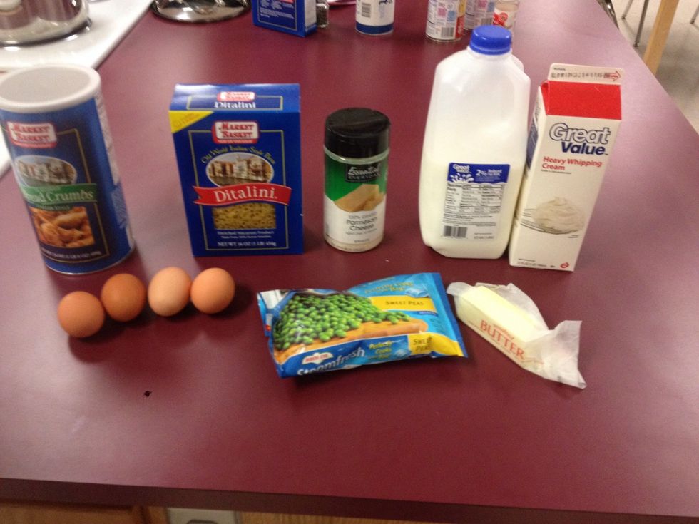 gather all your ingredients 1 Tbl. unsalted butter 2 Tbl. dried breadcrumbs 1/2 tsp. salt 1 lb. ditalini 4 eggs 1 c heavy cream 1 c milk 2 cups frozen peas, thawed & drained 1 1/2 cups Parmesan cheese