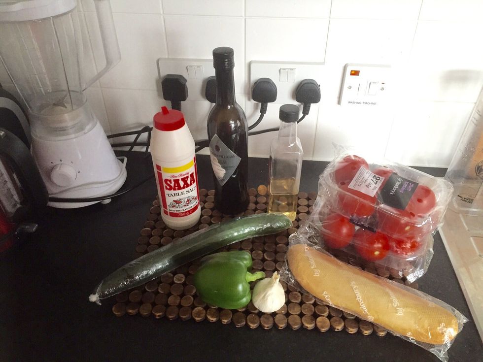 Gather all your ingredients. Before you start, put some of the bread in water to soften it up. It can be stale bread. The thicker you want the soup, the more bread you need