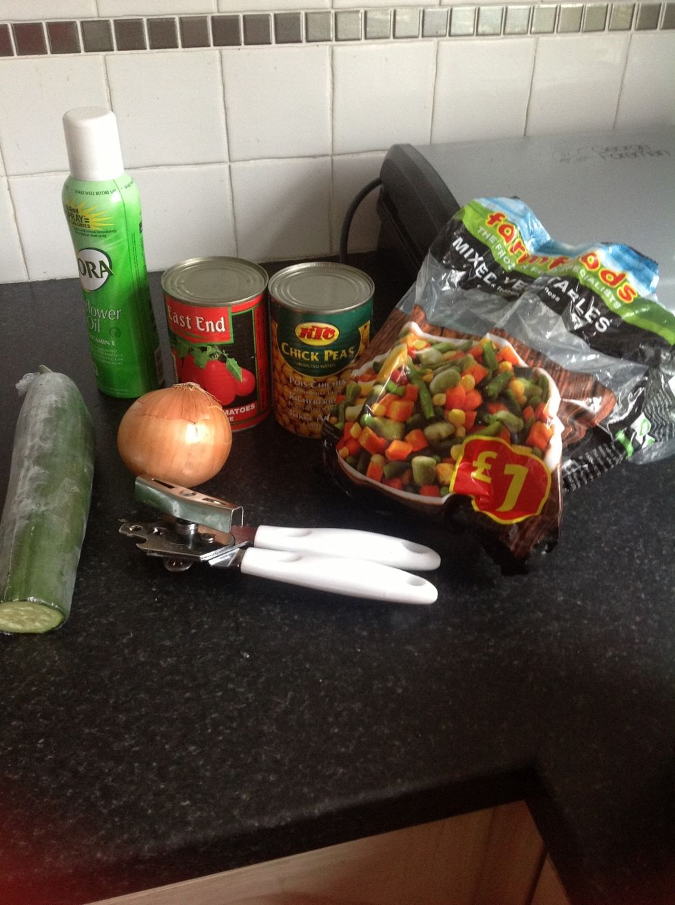 Gather all your ingredients..chop half an onion. Drain the chick peas