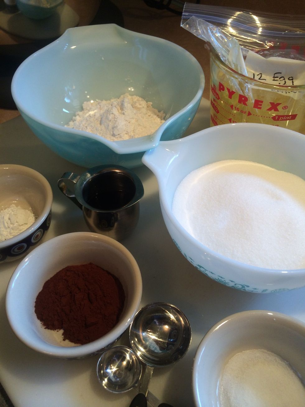 Gather all your ingredients. Flour, sugar, egg whites, cocoa, espresso, cream of tartar,  pure vanilla extract and salt.