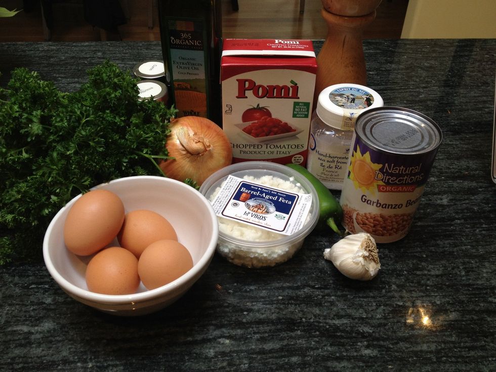 Gather all your ingredients. This recipe works best with super fresh eggs. Canned or boxed Pomi tomatoes work just fine if fresh are not in season.