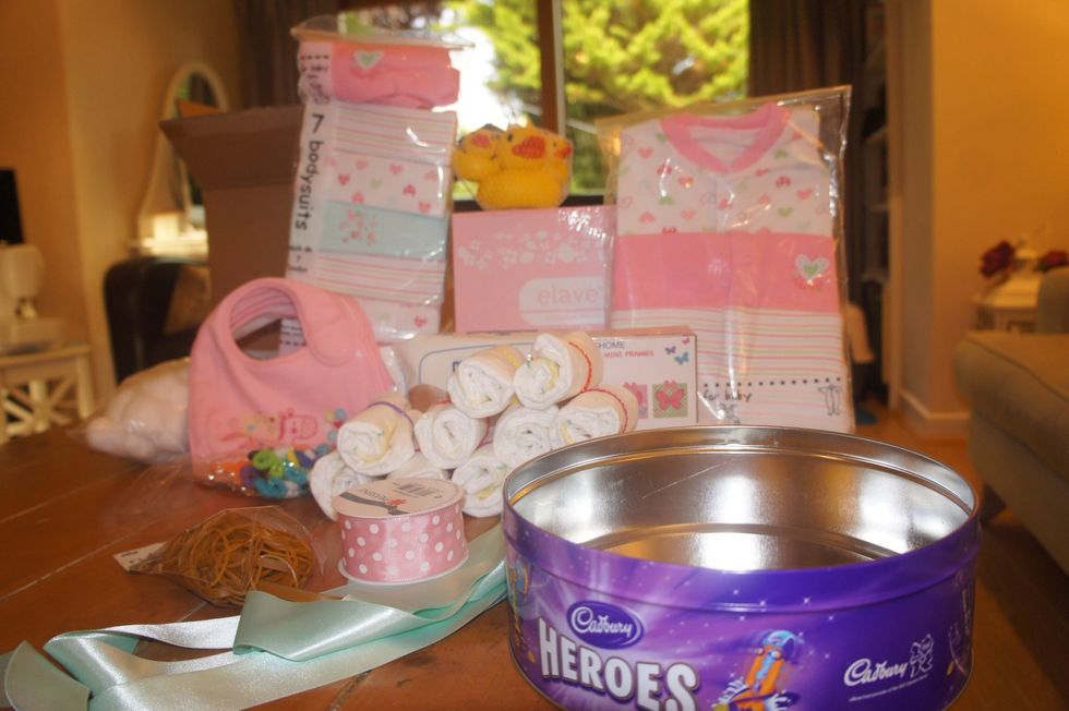 Gather all your materials needed (See Supplies section). Begin rolling the nappies and securing them with a baby bobbin.