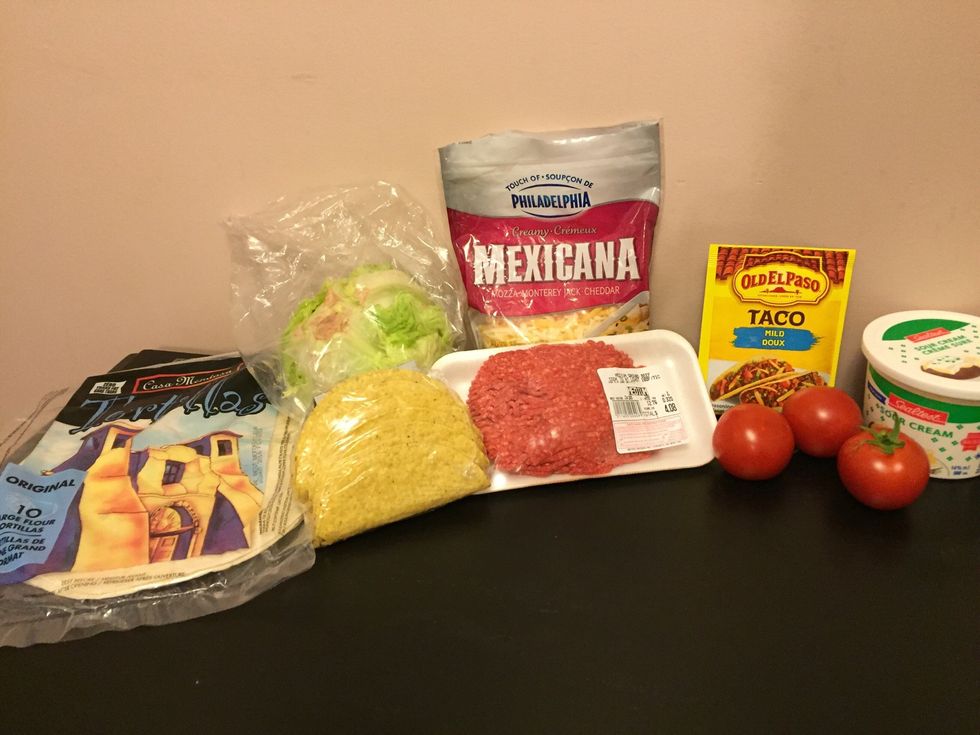 Gather all your supplies. Such as:\n\u2022ground beef\n\u2022lettuce\n\u2022tomatoes \n\u2022taco seasoning \n\u2022sour cream\n\u2022cheese\n\u2022shells (soft or hard)\n