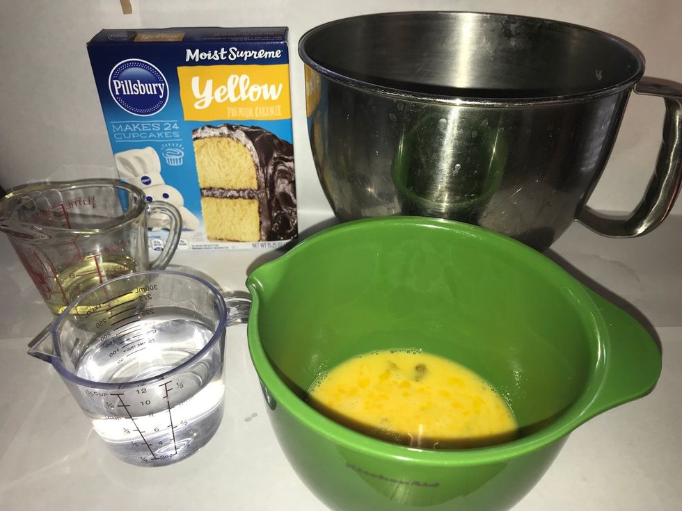 Gather cake ingredients: yellow cake mix(1 box), eggs(3), water(1c), and vegetable oil(1/4c)