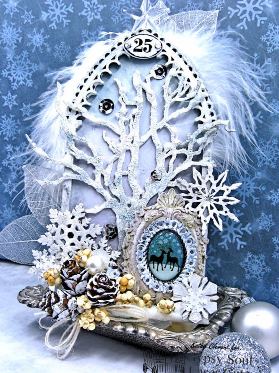 Gather chipboard pieces.  You will need the tree from the Winter Shape Set, several snowflakes from the Snowflake Shape Set and the Arch Reliquary from Gypsy Soul Laser Cuts.  Cover your work surface.